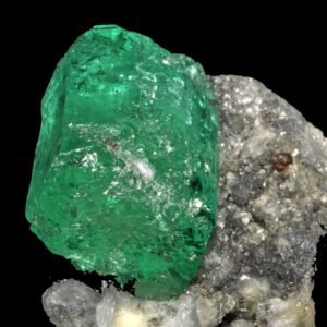 Natural rough emerald crystal on host rock