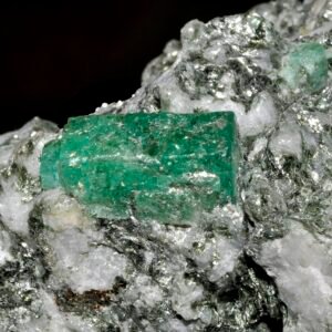 Rough emerald crystal with visible natural inclusions