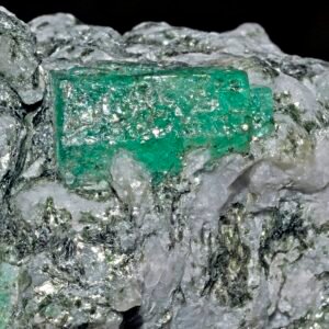 Hexagonal rough emerald crystal on host rock