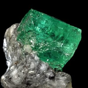 Rough emerald crystal with natural surface texture